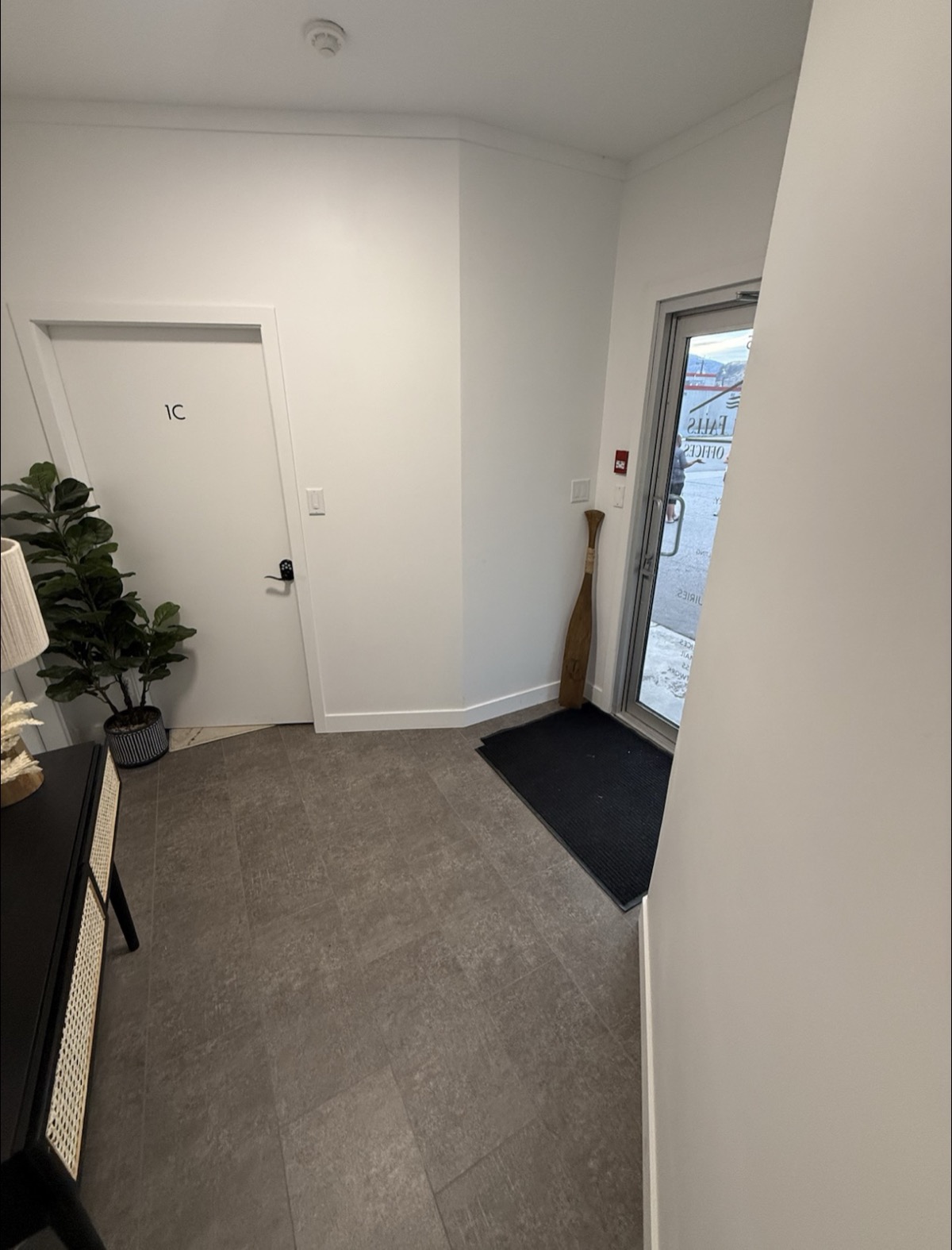 Interior entryway showing office 1C door and front entrance