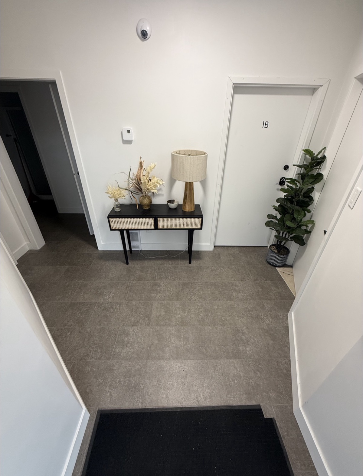 Professional entryway with numbered office doors and modern decor